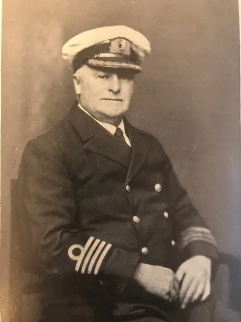 Photographic portrait of Captain Phillips, in Clan Line Captain's Uniform