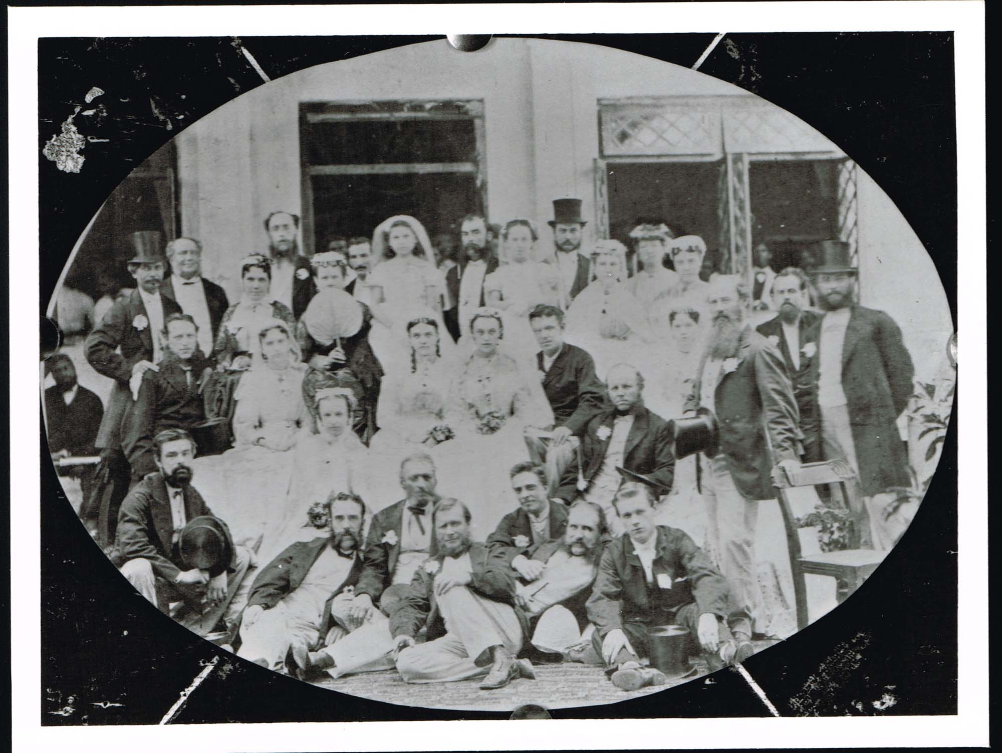 Black and white photograph of the wedding party of Charles Cayzer and Agnes Elizabeth Trickey following ceremony at St John's Church, Colaba, Bombay on 16th May 1868